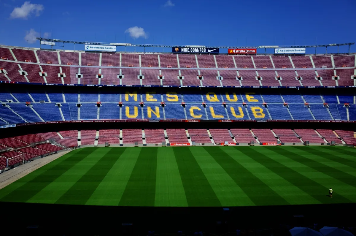 The empty stands of Camp Nou, with Més Que Un Club spelled out in the seating.