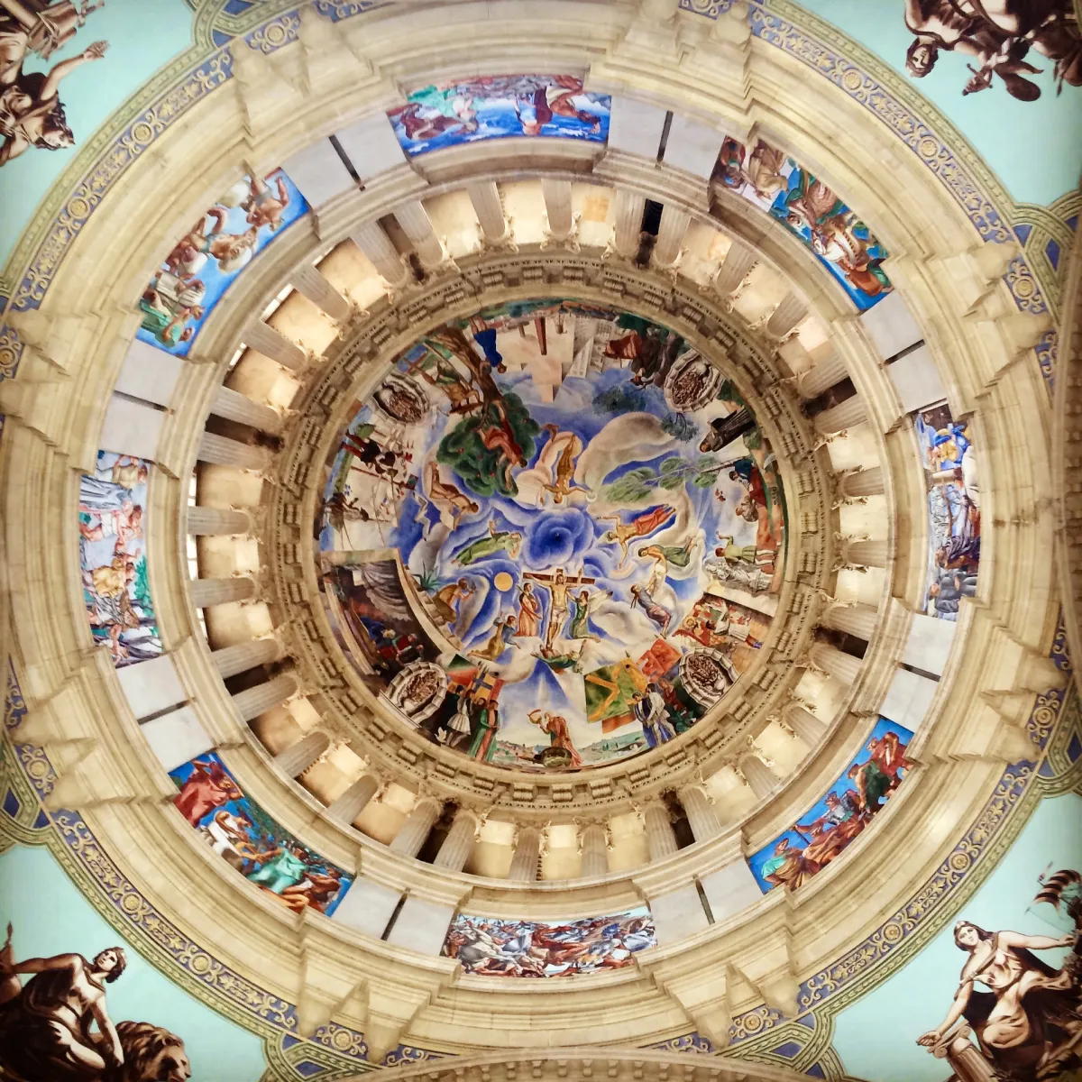 The painted interior of a dome seen from directly beneath.