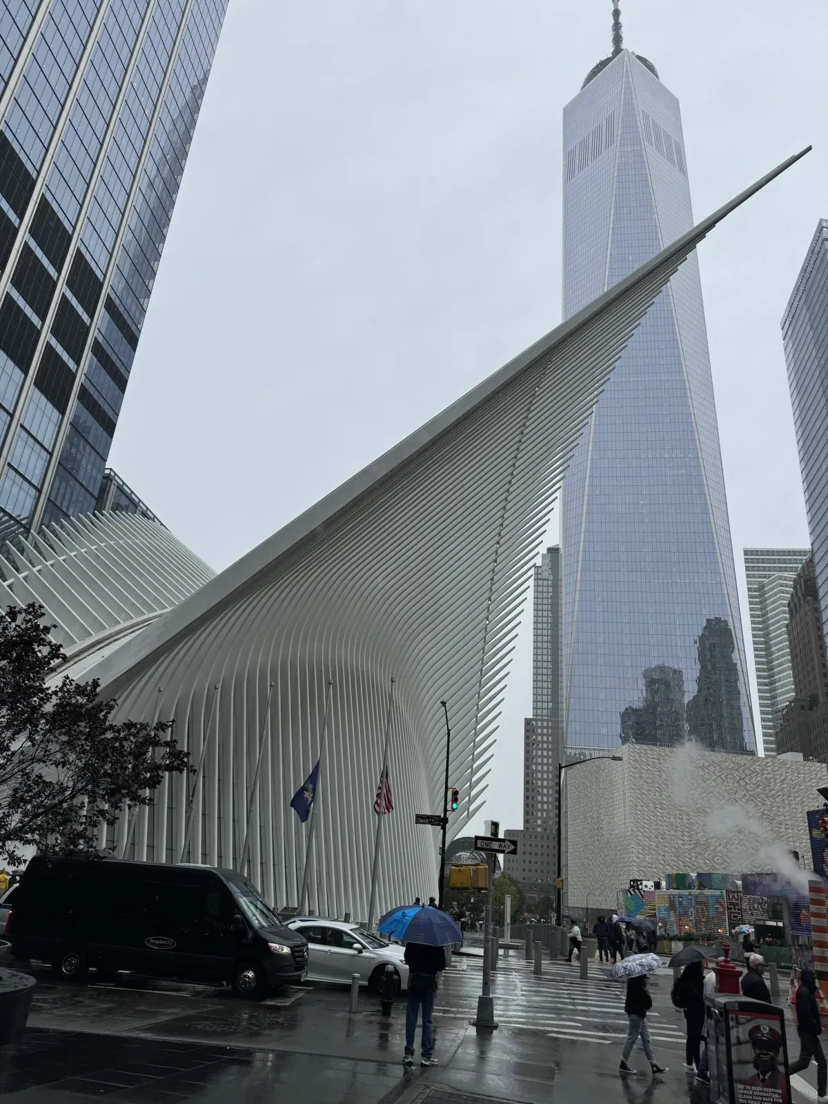 The white ribbed roof of the Oculus, with One World Trade Center behind it.