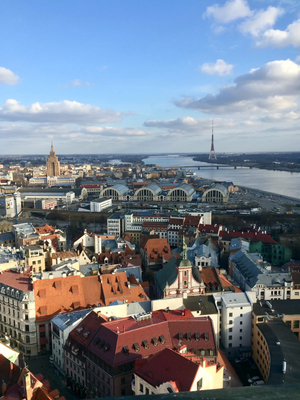 A rooftop view over the old town towards the radio tower and market halls.