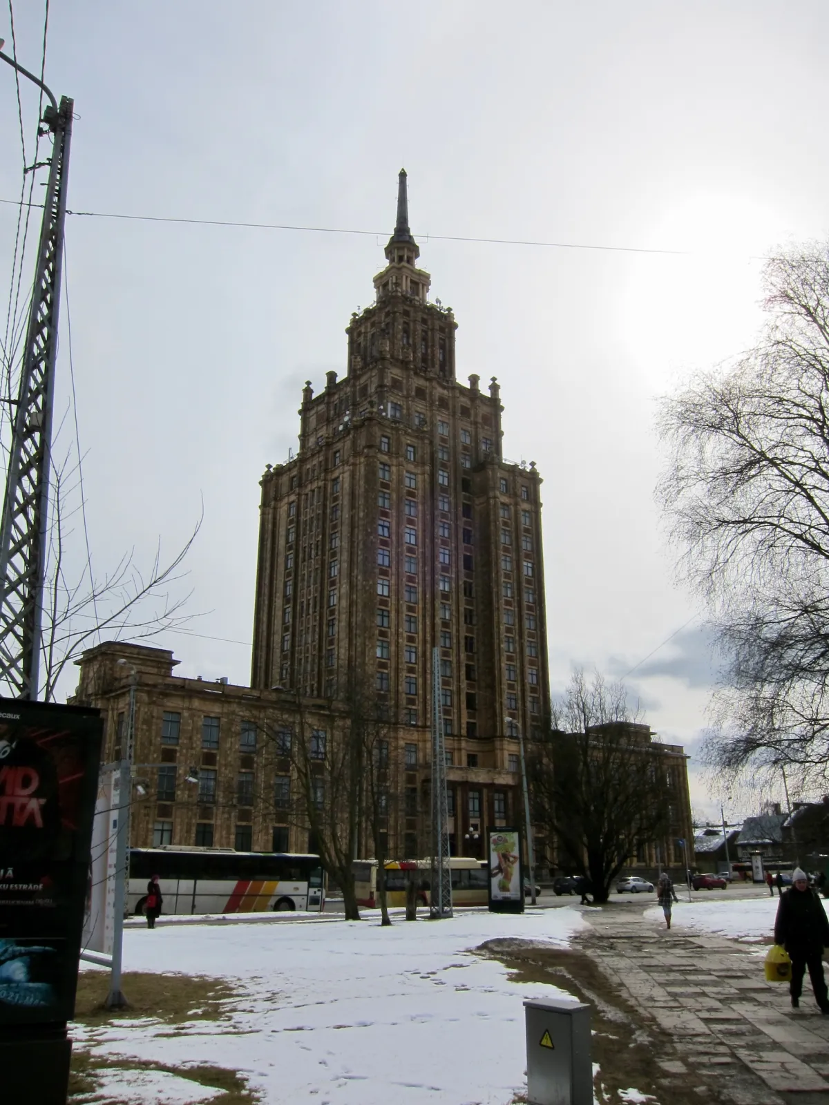 The Academy of Sciences tower rising above surrounding buildings on a grey winter day.