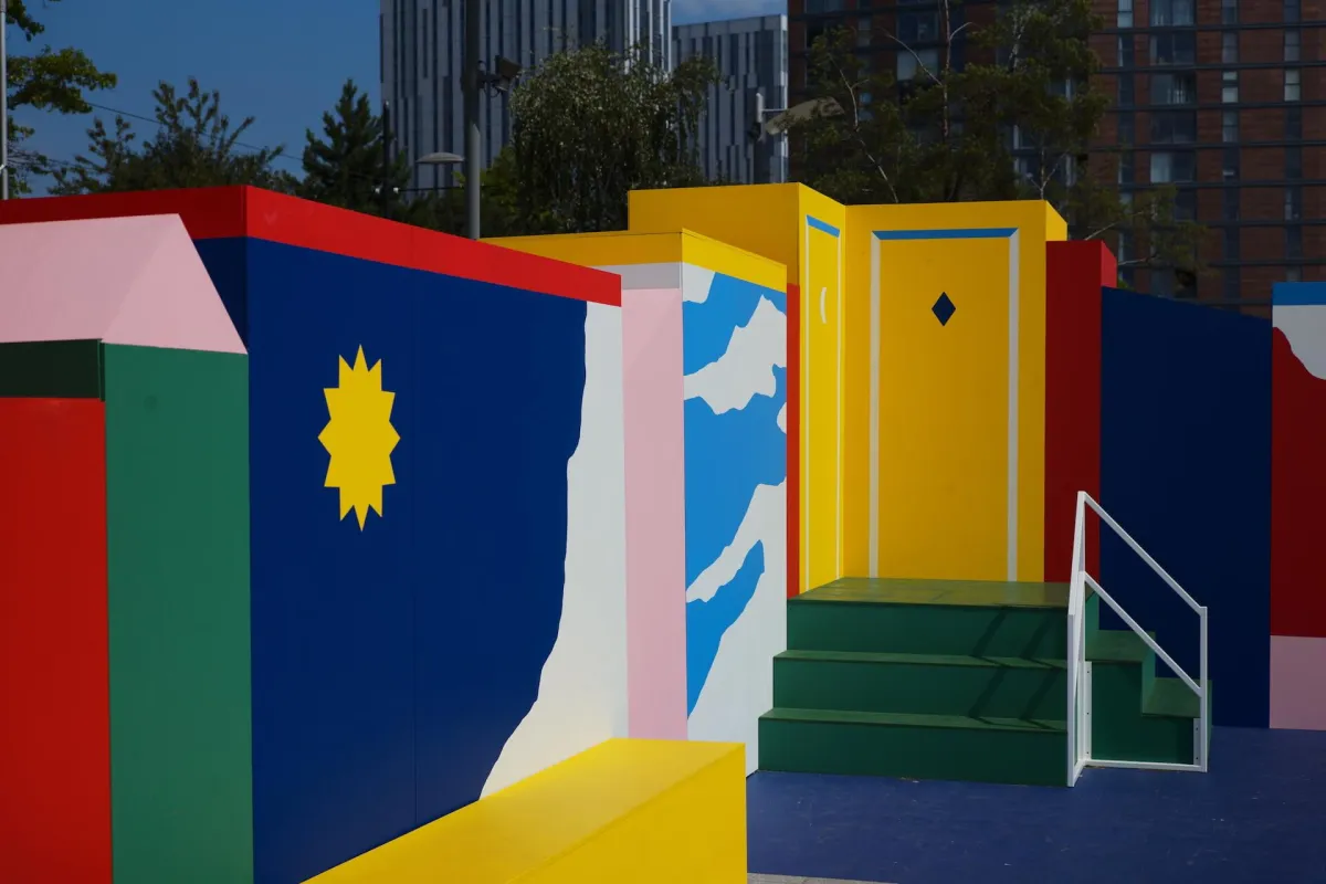 A brightly painted public artwork of blocks and steps in primary colours.