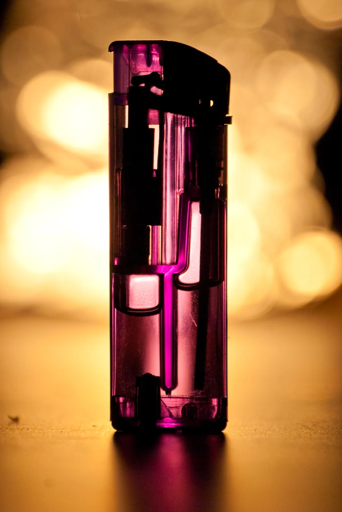 A macro shot of a plastic, disposable lighter